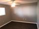 Comfortable bedroom featuring a ceiling fan and hardwood floors and a large window at 4120 Plantation Cove Dr # 301, Orlando, FL 32810