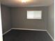 Comfortable bedroom featuring a hardwood floors and a large window providing plenty of light at 4120 Plantation Cove Dr # 301, Orlando, FL 32810