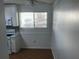 Cozy kitchen area with white appliances, tile backsplash and breakfast nook with natural light at 4120 Plantation Cove Dr # 301, Orlando, FL 32810