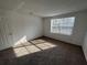 Bedroom with carpet, a window bringing in natural light at 4154 Versailles Dr # 4154D, Orlando, FL 32808