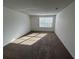 Cozy bedroom with neutral carpet and a window providing natural light at 4154 Versailles Dr # 4154D, Orlando, FL 32808