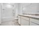 Bathroom with a bathtub, shower, toilet, granite countertop, modern cabinets, and a sink at 509 Madison Dr, Davenport, FL 33837