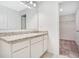 Bathroom featuring a granite countertop, modern cabinets, sink, and a view to a closet at 509 Madison Dr, Davenport, FL 33837