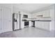 Modern kitchen equipped with stainless steel appliances, white cabinetry, and granite countertops at 509 Madison Dr, Davenport, FL 33837