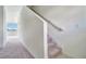 Carpeted staircase leading to the upper level of the home at 509 Madison Dr, Davenport, FL 33837