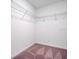 Walk-in closet with shelving and carpeting at 509 Madison Dr, Davenport, FL 33837