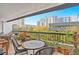 Relax on this beautifully decorated balcony with a view of the city skyline and lush greenery at 530 E Central Blvd # 303, Orlando, FL 32801