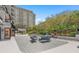 Tranquil courtyard with comfortable seating surrounded by lush greenery, perfect for enjoying the outdoors at 530 E Central Blvd # 303, Orlando, FL 32801