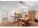 View of dining area with breakfast bar and stools that opens to a cozy kitchen with stainless appliances at 530 E Central Blvd # 303, Orlando, FL 32801