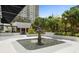 Serene outdoor space showcasing a decorative water fountain, surrounded by lush landscaping and vibrant flowers at 530 E Central Blvd # 303, Orlando, FL 32801