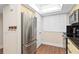 Kitchen featuring stainless steel refrigerator, oven, and cabinetry at 530 E Central Blvd # 303, Orlando, FL 32801