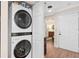 Laundry room with stacked washer and dryer units at 530 E Central Blvd # 303, Orlando, FL 32801