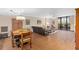 Bright open concept living room with dining area, balcony access, and comfortable seating arrangement at 530 E Central Blvd # 303, Orlando, FL 32801