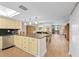 Open-concept living space with natural light, an island, and a smooth transition to the dining area at 530 E Central Blvd # 303, Orlando, FL 32801