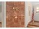 Elegant entryway with a distinctive marble wall featuring the building's address: 530 at 530 E Central Blvd # 303, Orlando, FL 32801
