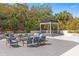 Comfortable outdoor seating area with lush landscaping providing an inviting space for gatherings at 530 E Central Blvd # 303, Orlando, FL 32801