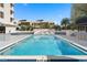 Spacious community pool with lounge chairs and a sundeck for enjoying the beautiful outdoors at 530 E Central Blvd # 303, Orlando, FL 32801