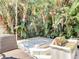 A private spa provides a relaxing retreat, surrounded by tropical foliage at 554 Queensbridge Dr, Lake Mary, FL 32746
