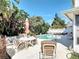 Outdoor living space with private pool, patio seating, and lush landscaping, perfect for entertaining at 554 Queensbridge Dr, Lake Mary, FL 32746