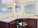 Bathroom with dual sinks, dark wood cabinets, and an octagonal mirror at 554 Queensbridge Dr, Lake Mary, FL 32746
