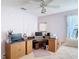 Comfortable bedroom with a wooden desk, plush carpeting, and a ceiling fan at 554 Queensbridge Dr, Lake Mary, FL 32746