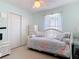 Bright bedroom with mint walls, plush carpeting and a double door closet at 554 Queensbridge Dr, Lake Mary, FL 32746