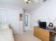 Bedroom featuring a closet, tv atop a dresser, and a daybed, all with carpet floors at 554 Queensbridge Dr, Lake Mary, FL 32746