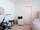Bright bedroom with mint walls, plush carpeting and a double door closet at 554 Queensbridge Dr, Lake Mary, FL 32746