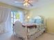 Bedroom with an exit to the outdoor space, a ceiling fan, and hardwood floors at 554 Queensbridge Dr, Lake Mary, FL 32746