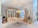 Charming dining area with a round table, stylish hutch, and window views, perfect for entertaining guests at 554 Queensbridge Dr, Lake Mary, FL 32746