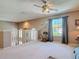 Bright upstairs loft area with neutral carpet, white railings and a large sunlit window at 554 Queensbridge Dr, Lake Mary, FL 32746