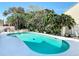 An inviting private pool in a lush backyard, creating a personal oasis for relaxation at 554 Queensbridge Dr, Lake Mary, FL 32746
