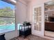 Enclosed patio with a view of the pool, tile floors and access to the main house at 554 Queensbridge Dr, Lake Mary, FL 32746