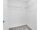 Walk in closet featuring metal shelving and light gray carpet at 6424 Tabebuia Pkwy, Winter Garden, FL 34787