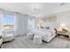 Bright main bedroom features two large windows with a view, carpet, and white furniture at 6424 Tabebuia Pkwy, Winter Garden, FL 34787