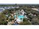 Stunning aerial view of the community pool, showcasing the resort-style amenities at 7464 Gathering Dr, Reunion, FL 34747