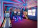 Fun circus themed room with a unique design, arcade games and slide at 7464 Gathering Dr, Reunion, FL 34747