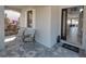 Cozy front porch with stylish seating, plants, and a welcoming entrance to the home at 7464 Gathering Dr, Reunion, FL 34747