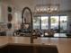 Modern kitchen sink looking out to a view of the dining and living area at 7464 Gathering Dr, Reunion, FL 34747
