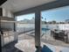 Beautiful outdoor living space with built in grill and view of a modern pool and spa at 7464 Gathering Dr, Reunion, FL 34747