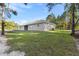Exterior view showcases the home's backyard and landscaped lawn at 8015 Sw 133Rd Ln, Ocala, FL 34473