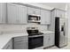 Well-equipped kitchen featuring stainless steel appliances and bright countertops at 8015 Sw 133Rd Ln, Ocala, FL 34473