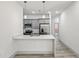 Modern kitchen features stainless steel appliances, gray cabinets, and quartz countertops at 8015 Sw 133Rd Ln, Ocala, FL 34473