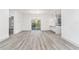 Bright, modern open-plan living space features lovely hard surface floors and natural light at 8015 Sw 133Rd Ln, Ocala, FL 34473