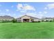 Single Gathering home with expansive lawn and manicured landscaping at 8614 Hata St, Orlando, FL 32827