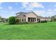 Single Gathering home with expansive lawn and manicured landscaping at 8614 Hata St, Orlando, FL 32827