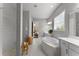 Bright bathroom displaying a walk-in shower and soaking tub beside a big window at 8614 Hata St, Orlando, FL 32827