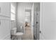 Clean bathroom featuring a toilet, shower, and a window allowing natural light in at 8614 Hata St, Orlando, FL 32827
