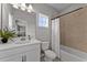 Well-lit bathroom featuring a shower-tub combination and a contemporary vanity at 8614 Hata St, Orlando, FL 32827