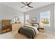 Comfortable bedroom featuring neutral walls and a large window at 8614 Hata St, Orlando, FL 32827